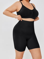 High waisted body shaper shorts in black worn by a model.