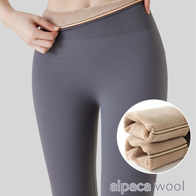 Fleece-lined high waist leggings for women, gray with alpaca wool lining detail.